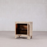 Wooden side table with a rustic finish on a plain background