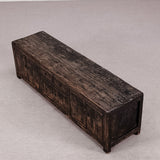 Long wooden cabinet with a rustic finish on a neutral background
