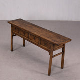 Wooden bench with drawers on a plain background
