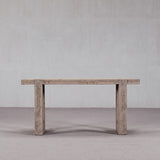 Wooden console table against a plain wall