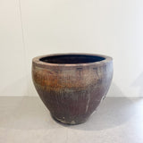 Brown ceramic pot on a white background