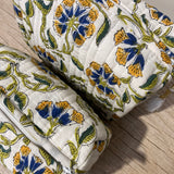 Floral-patterned fabric on a wooden surface