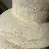 Close-up of a textured stone vase