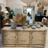 Wooden sideboard with decorative vases in a home decor store