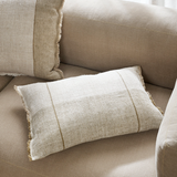 Beige pillow on a beige sofa