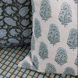 Two fabric swatches with different patterns on a checkered surface