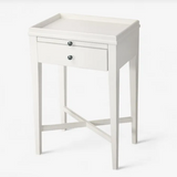 White side table with a drawer on a white background
