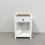 White bedside table with rattan top