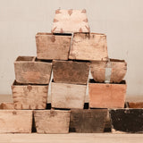 A collection of antique wooden buckets in various sizes, with a focus on a large bucket at the top, indicating the product's vintage appeal.