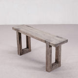 Wooden bench with rustic design on a plain background