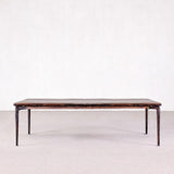 Rectangular wooden table with metal legs on a white background
