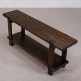 Wooden bench with a shelf on a gray background