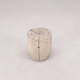 Wooden log stool on a light gray background