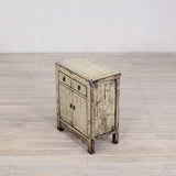 Vintage wooden cabinet on a wooden floor with a white wall background