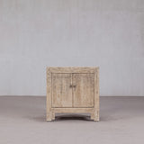 Vintage wooden cabinet with two doors on a plain background