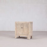 Wooden cabinet with two doors on a plain background