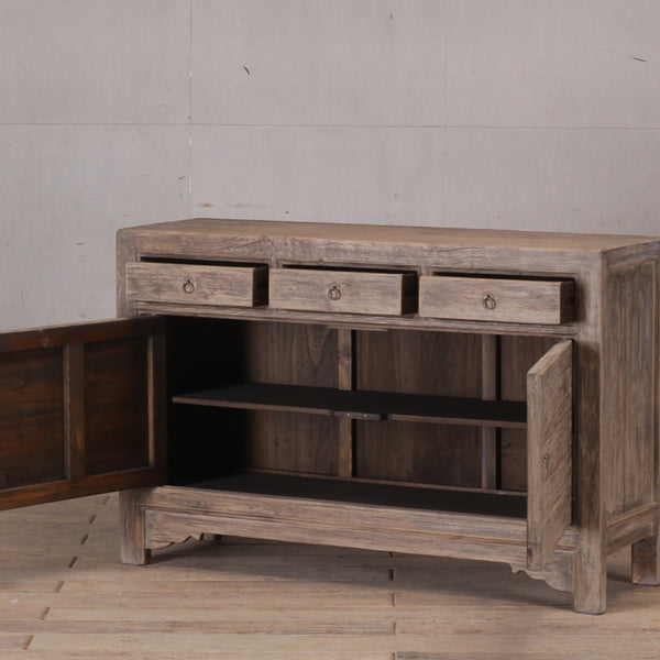 Natural Cabinet with three drawers and two doors.