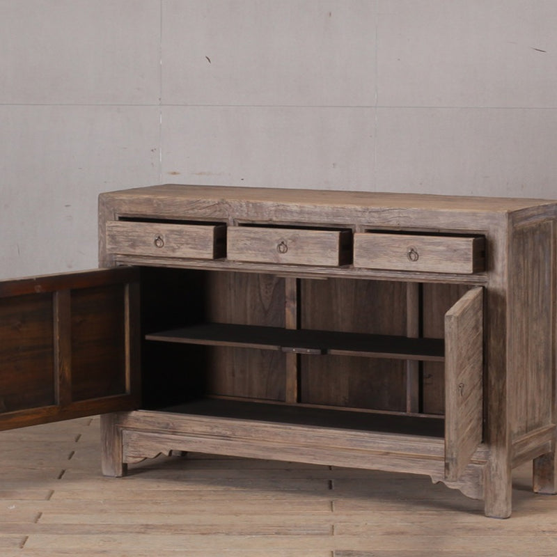 Natural Cabinet with three drawers and two doors.