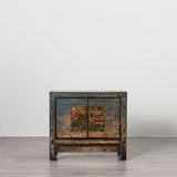 Small gloss cabinet with artwork on the front