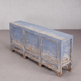 Vintage-style blue wooden cabinet on a neutral background