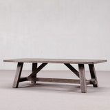 Wooden coffee table with a rustic design on a plain background