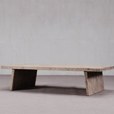 Wooden coffee table with a minimalist design on a plain background