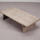 Wooden coffee table on a plain floor
