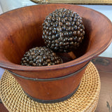 Antique wooden bowl with metal rings