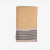 Folded fabric towel with a two-tone design on a white background