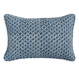 A rectangular lumbar throw pillow featuring a textured blue and white ikat pattern, shown against a plain white background.