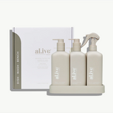 Set of 'alive' skincare products including bottles and a box on a white background