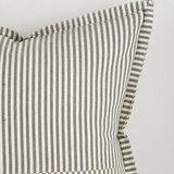Striped fabric with a visible seam on a light gray background