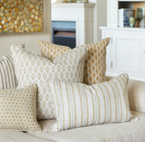 Decorative pillows on a sofa in a living room setting