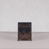 Vintage wooden cabinet against a plain background